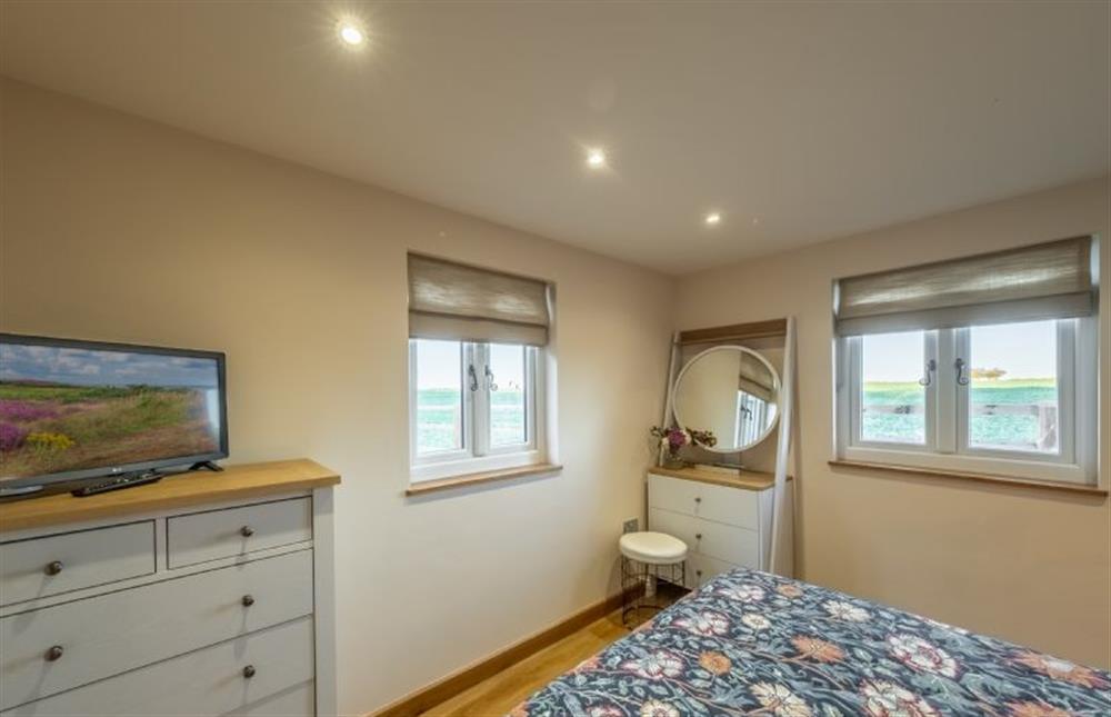 Dual aspect master bedroom at Bumblebee Cottage, Culford Heath near Bury Saint Edmunds