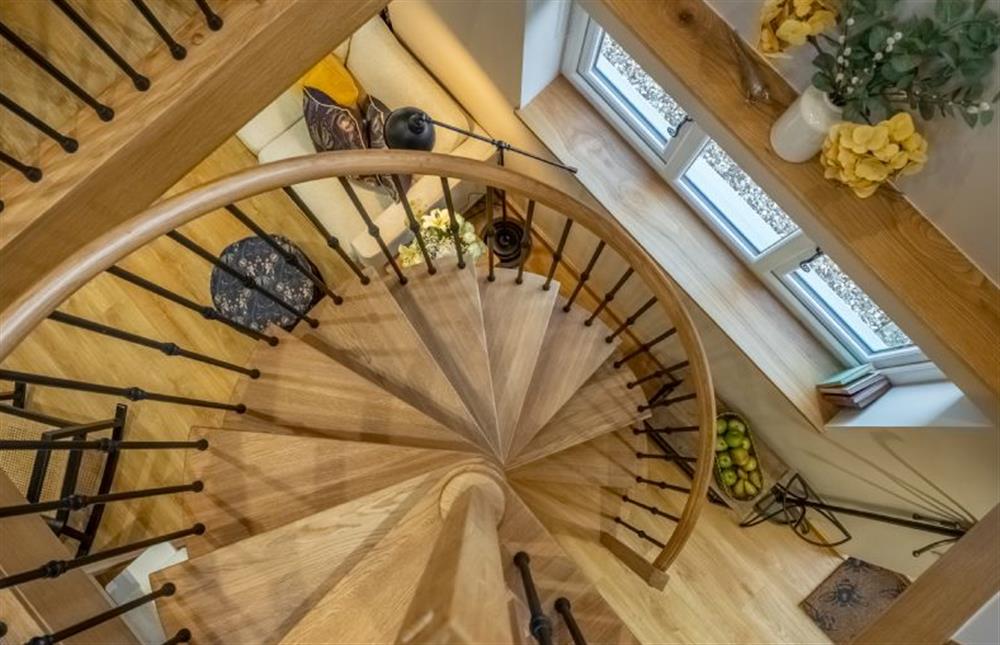 Spiral stairs to the twin bedroom at Bumblebee Cottage, Culford Heath near Bury Saint Edmunds