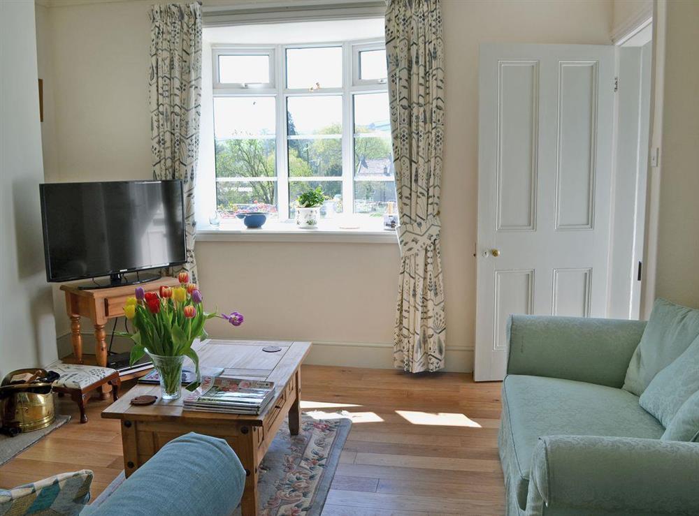 Beautifully designed living room with woodburner (photo 2) at Bumblebee Cottage in Marske near Richmond, North Yorkshire