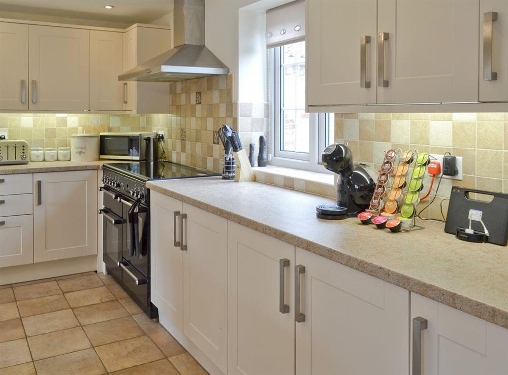 Well-equipped fitted kitchen at Bumblebee Cottage in Skipsea, near Hornsea, North Humberside