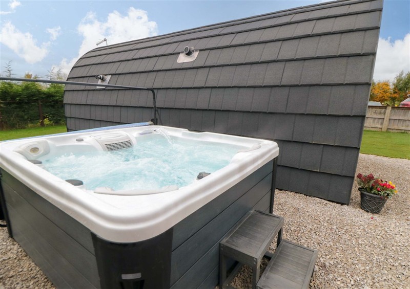 Relax in the hot tub at Bumblebee Glamping Pod, Thornton Dale