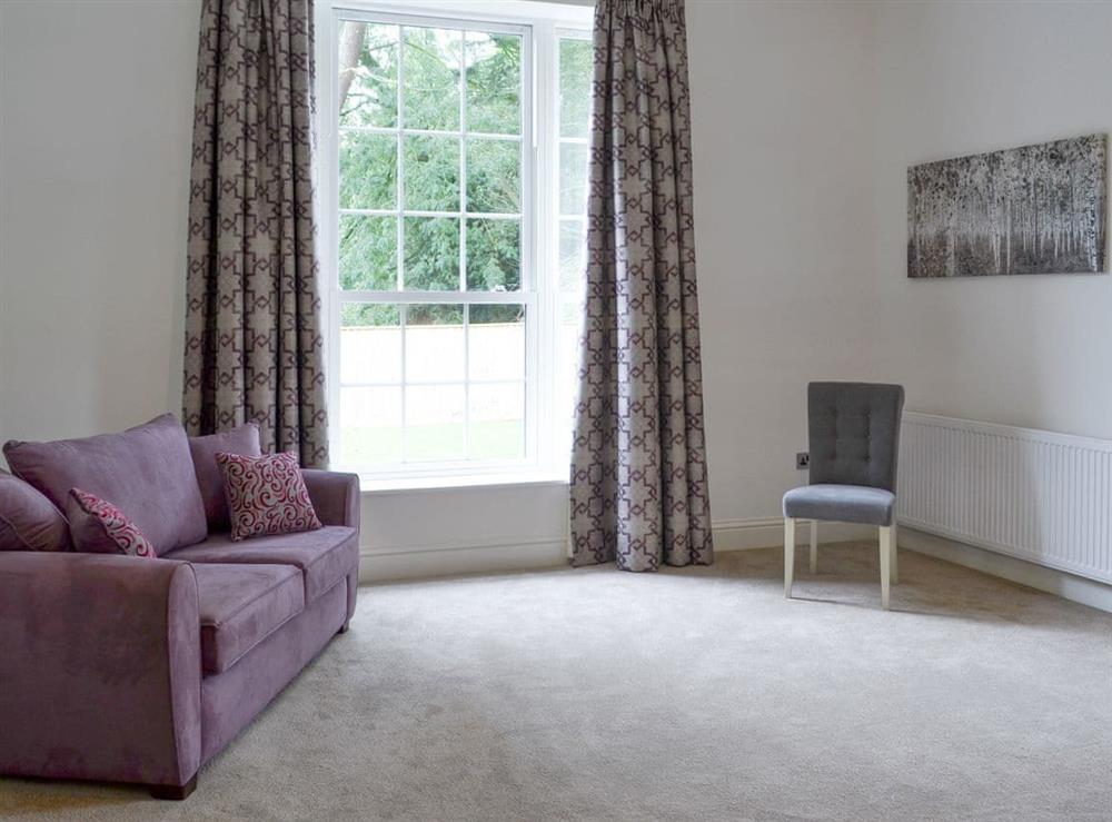 Spacious seating area within the double bedroom at Chester, 
