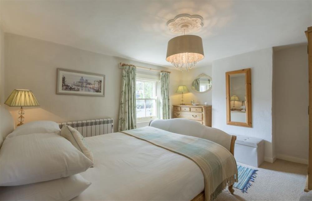 First floor: Master bedroom with king-size bed (photo 2) at Burnham Cottage, Wells-next-the-Sea