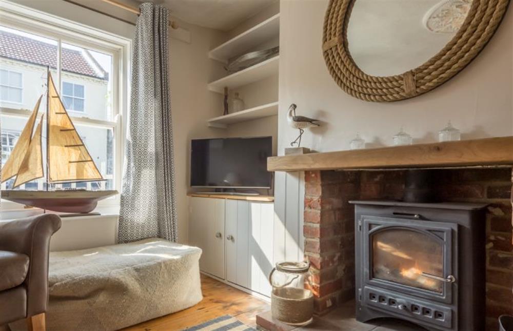 Ground floor: Sitting room with wood burning stove at Burnham Cottage, Wells-next-the-Sea