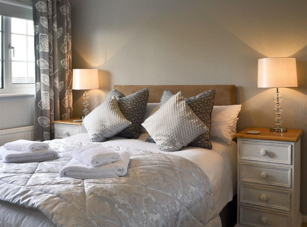 Elegant bedroom with double bed at Burns Knott in Keswick, Cumbria