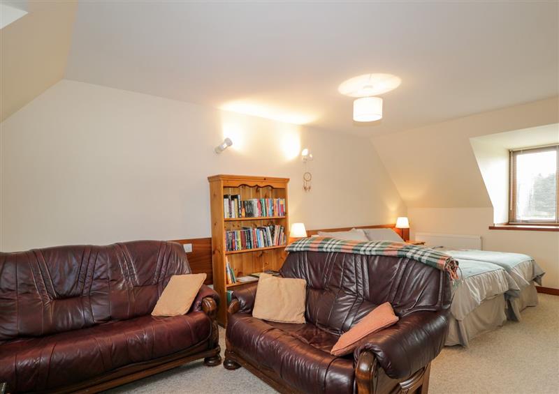 Enjoy the living room at Burnside Cottage, Lairg