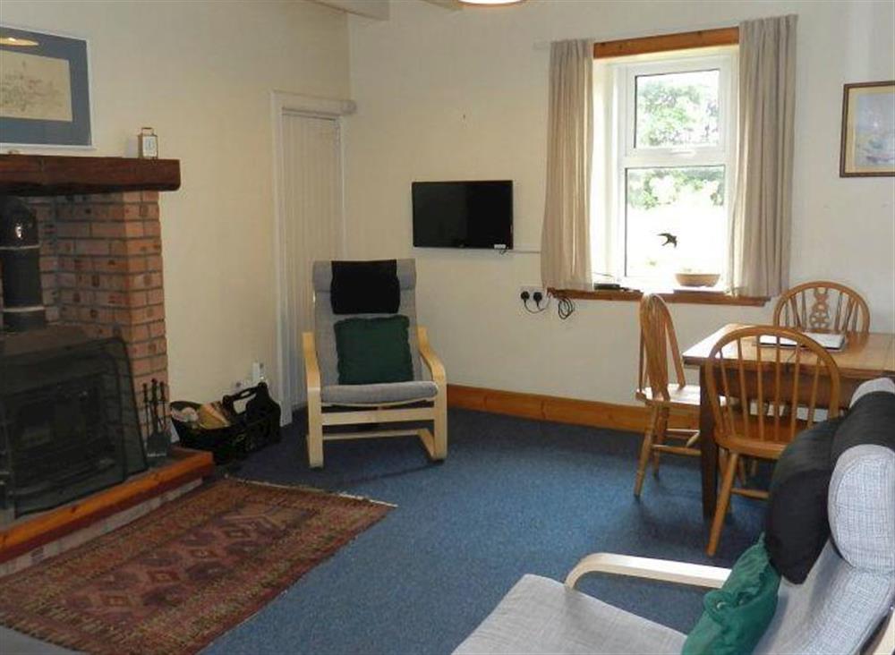 Living room/dining room at Burnside Cottage in Sliddery, Isle of Arran, Scotland