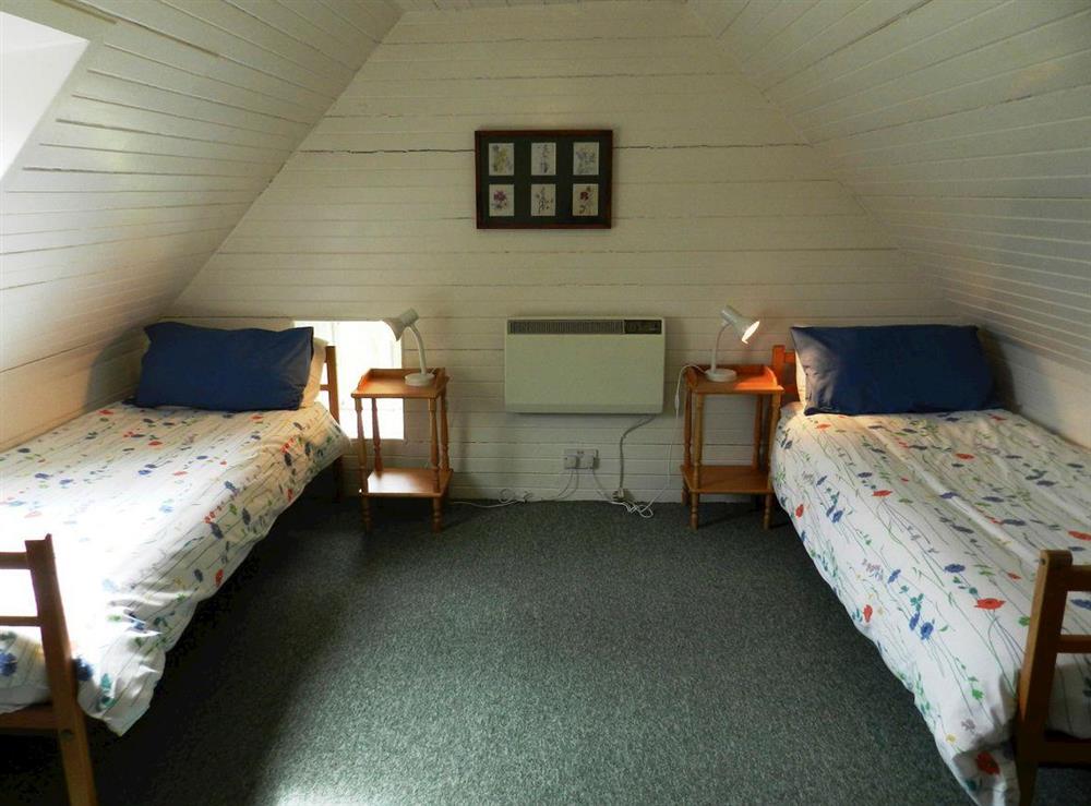 Twin bedroom at Burnside Cottage in Sliddery, Isle of Arran, Scotland