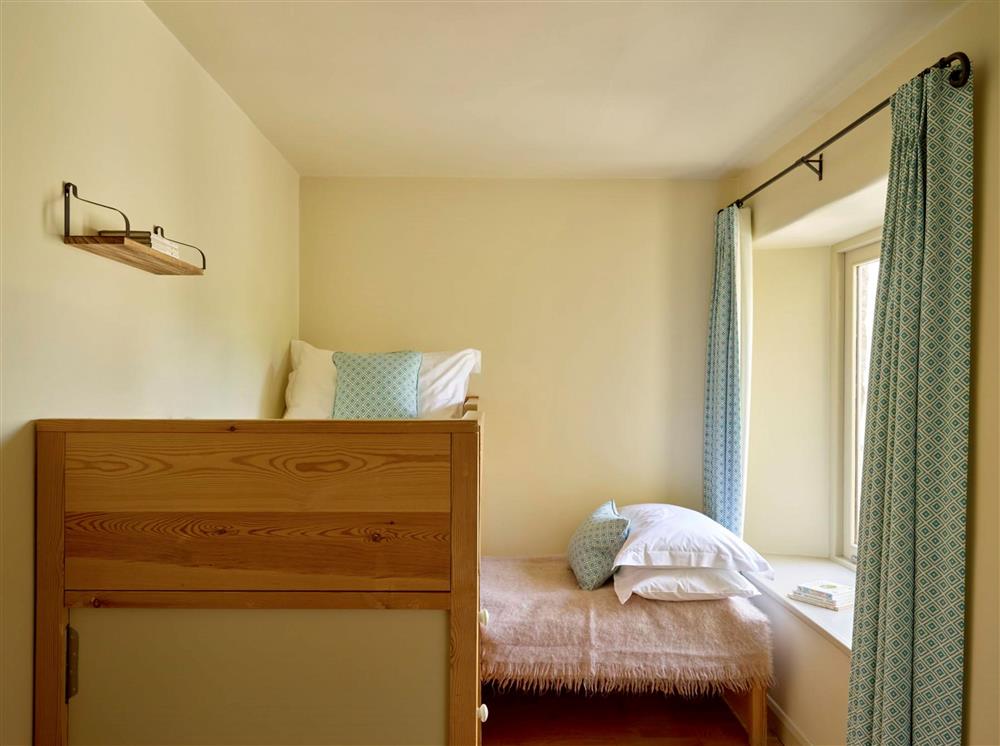 Bedroom three, with compact twin with L-shaped cabin beds, suitable for under 12’s at Burrator Cottage, Dartmouth