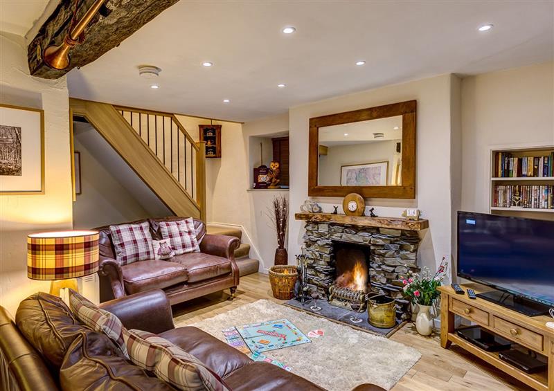 Relax in the living area at Burrow Cottage, Bowness