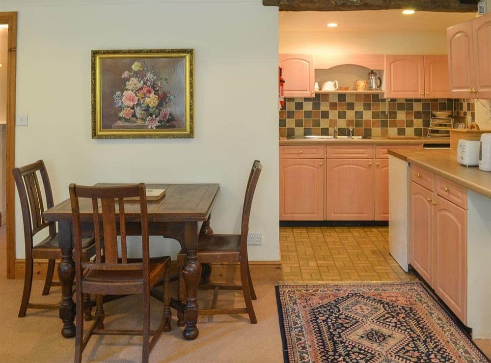 Modest dining area and adjacent kitchen at Gardener’s Rest, 