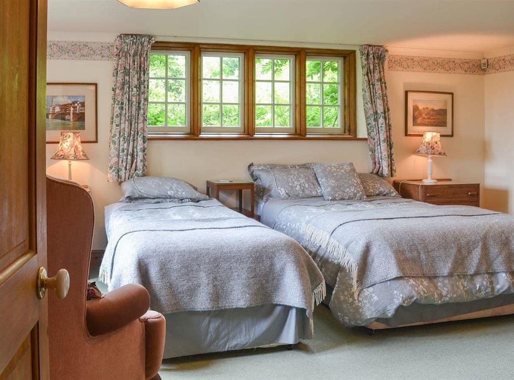 Welcoming bedroom with additional single bed at Gardener’s Rest, 