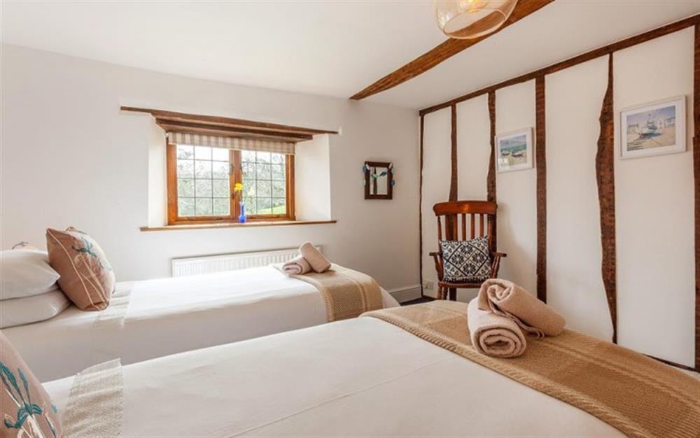 Bedroom 2 with zip link twin 3 ft beds which can be made as super King size bed  (photo 2) at Burrow Hill Cottage in Honiton