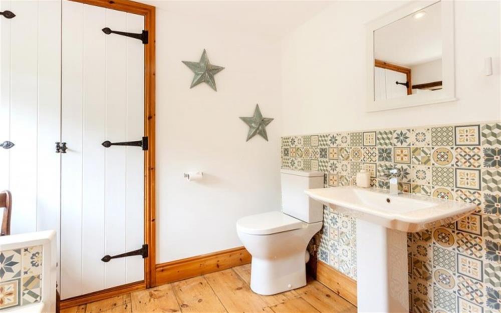Large family bathroom with bath, hand basin, w.c. and heated towel rail.   (photo 2) at Burrow Hill Cottage in Honiton