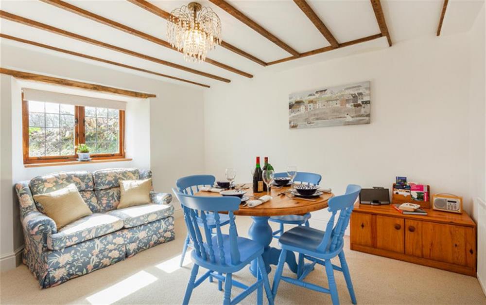 Separate dining room with chairs at Burrow Hill Cottage in Honiton