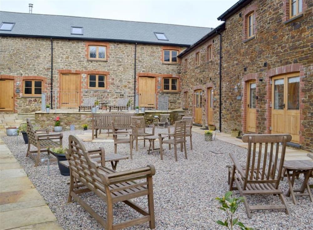 Shared enclosed gravelled patio area at The Hayloft, 