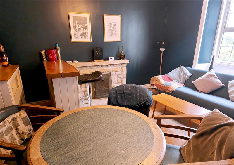 Relax in the living area at Bush Nook House, Brampton