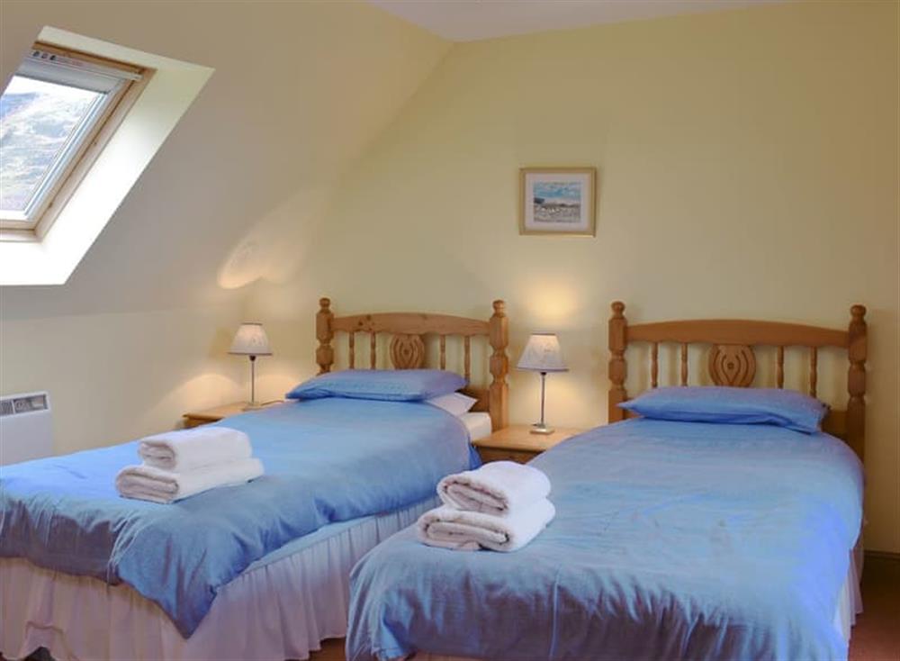 Comfy twin bedroom at Bushmill Cottage in East Bennan, Isle of Arran, Scotland