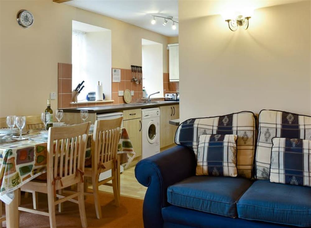 Well presented open plan living space at Bushmill Cottage in East Bennan, Isle of Arran, Scotland