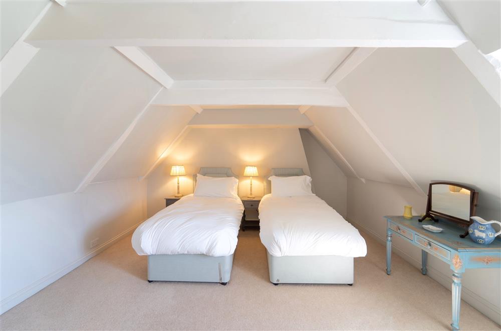 Comfortable beds with lots of storage space in each bedroom at Butley Priory Farmhouse, Woodbridge