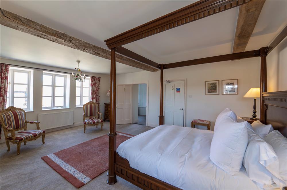 Four-poster bed in a luxurious bedroom at Butley Priory Farmhouse, Woodbridge
