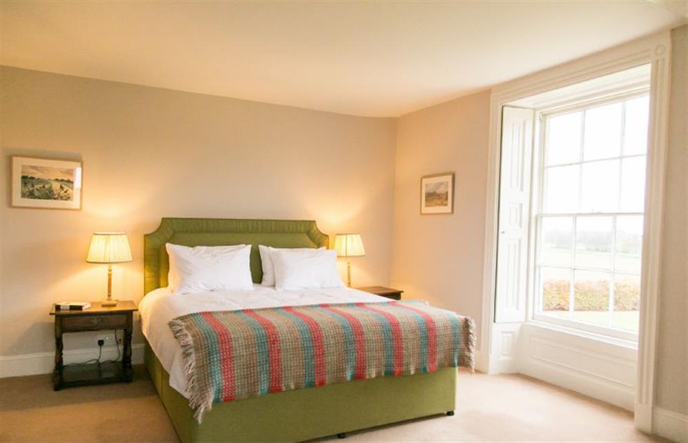 Large windows allow the room to be bathed in natural light  at Butley Priory Farmhouse, Woodbridge