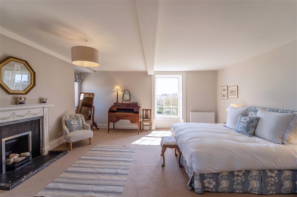 Ornamental fireplaces, seating and large comfortable beds make this a delightful stay at Butley Priory Farmhouse, Woodbridge