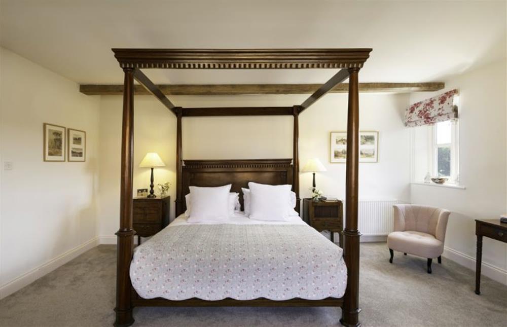 Relax in the grandeur of the four-poster bed  at Butley Priory Farmhouse, Woodbridge