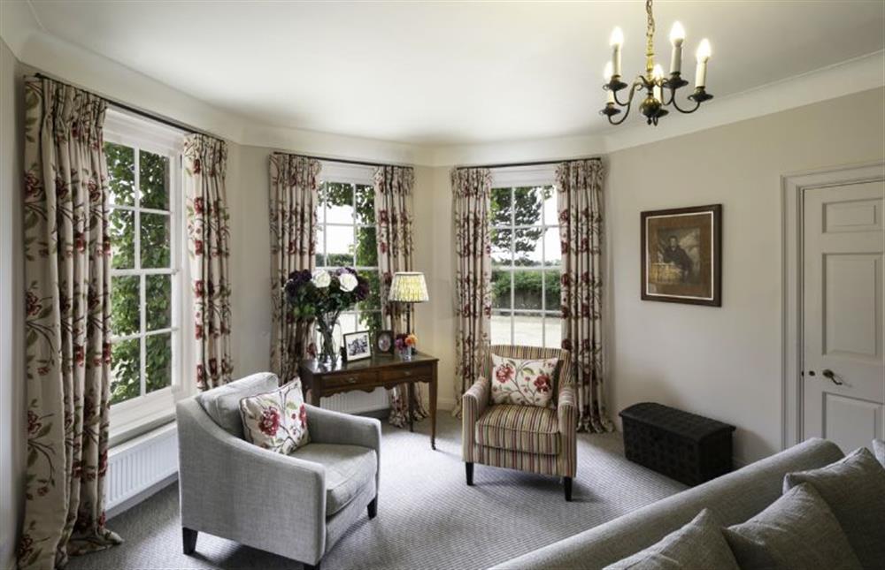 While away the evening curled up in the armchairs with your favourite book  at Butley Priory Farmhouse, Woodbridge