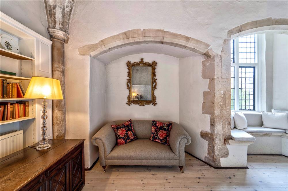 Comfortable seating and plenty of books to read at Butley Priory, Woodbridge