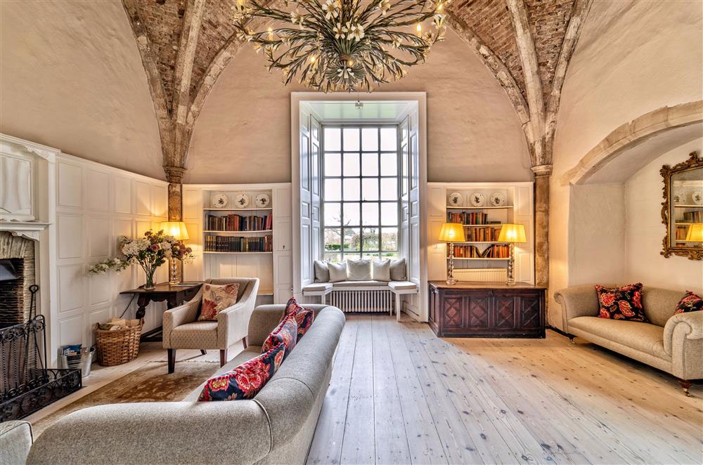 The handsome drawing room provides further seating at Butley Priory, Woodbridge