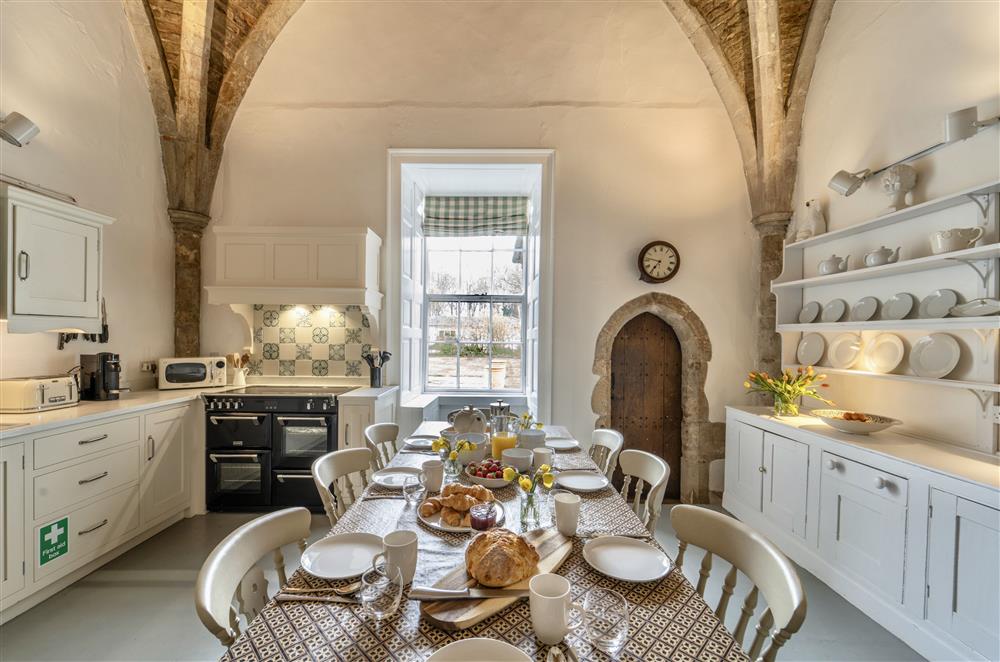 The kitchen with vaulted ceilings and original features at Butley Priory, Woodbridge
