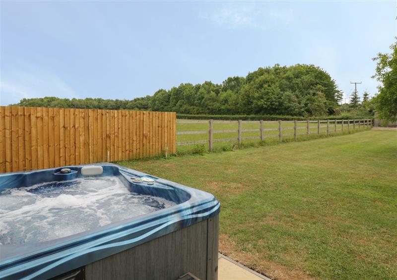 Relax in the hot tub at Buttercups at Midway, Kington