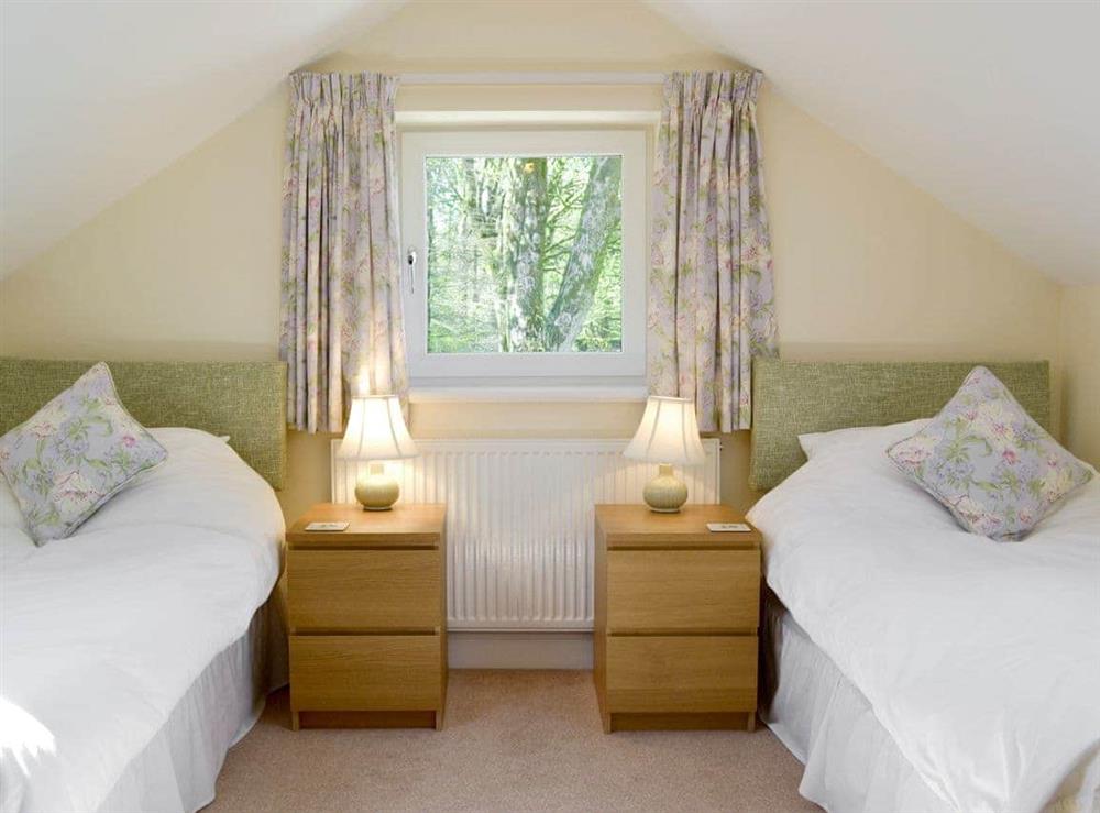 Relaxing first floor twin bedroom at Butterfly Cottage in Kendal, Cumbria