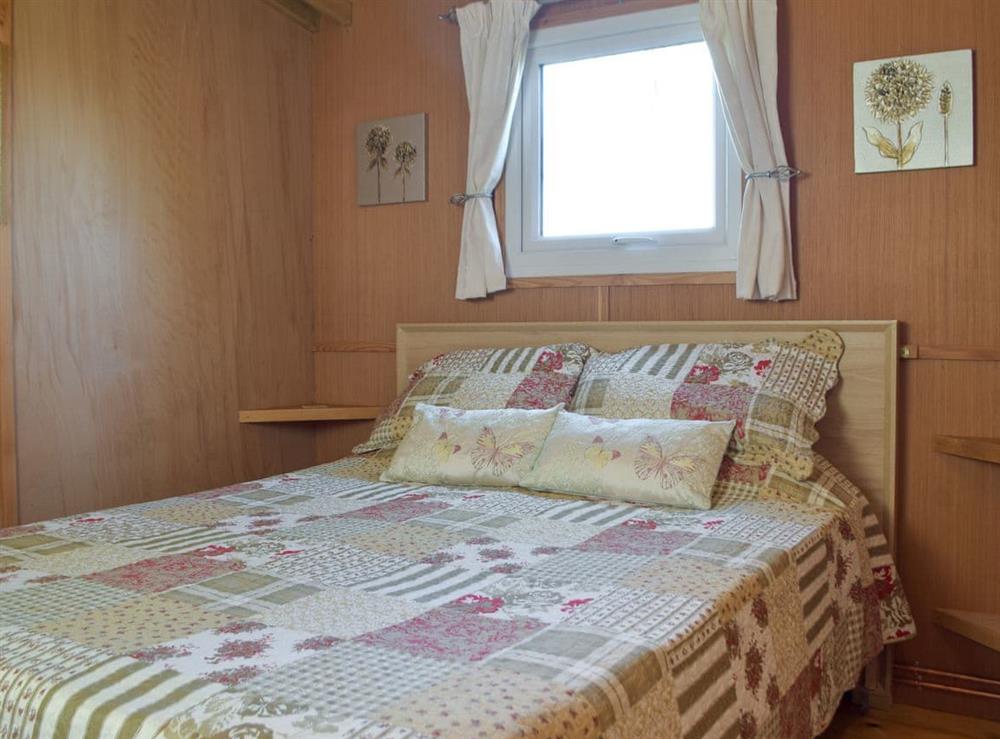 Double bedroom at Butterfly Lodge in Saron, Dyfed