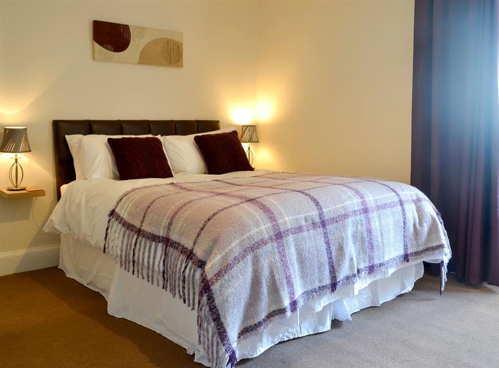 Comfy bedroom with kingsize bed at Butterhole Farmhouse in Mabie, near Dumfries, Dumfriesshire