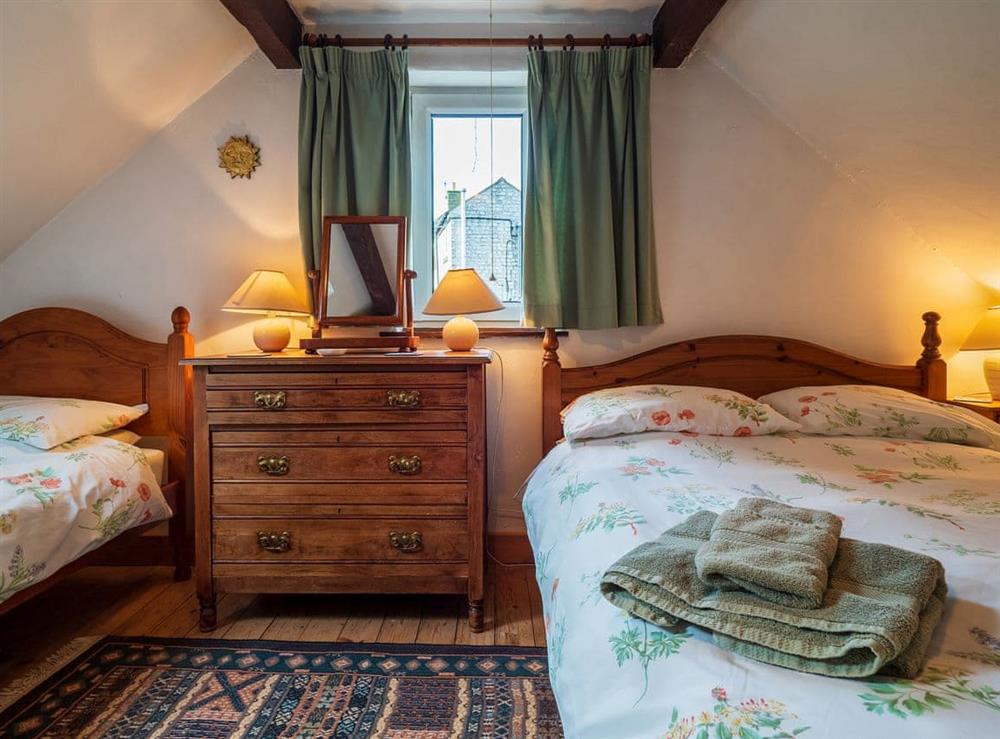 Large second bedroom with double and single beds at Buttermilk Cottage in Youlgreave, near Bakewell, Derbyshire
