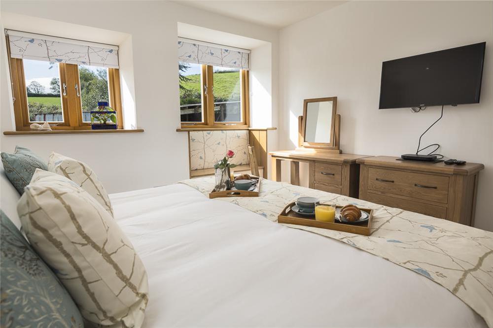 A second en-suite master bedroom with super-King size bed (photo 2) at Butterwell Barn in , Nr Dartmouth
