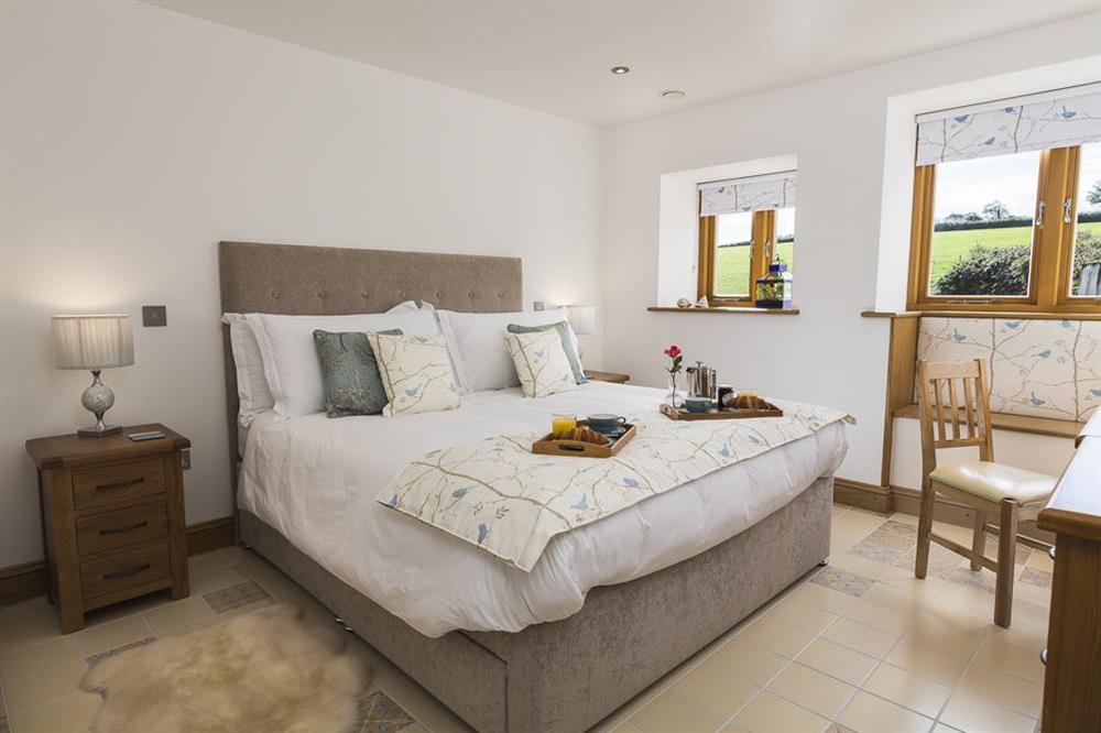 A second en-suite master bedroom with super-King size bed at Butterwell Barn in , Nr Dartmouth