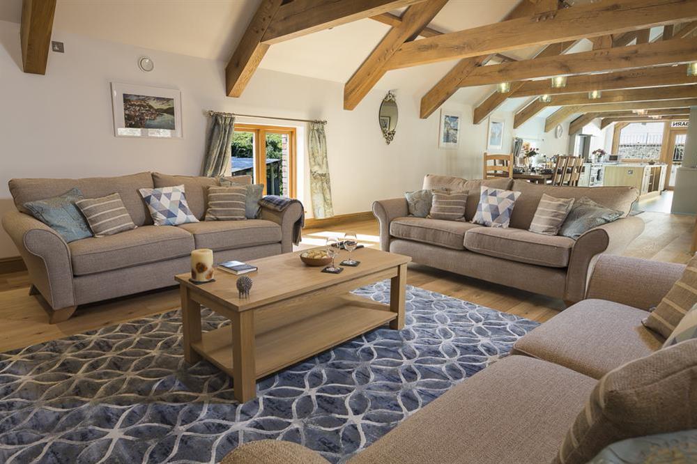 Comfortably furnished, open plan sitting area with three double settees at Butterwell Barn in , Nr Dartmouth