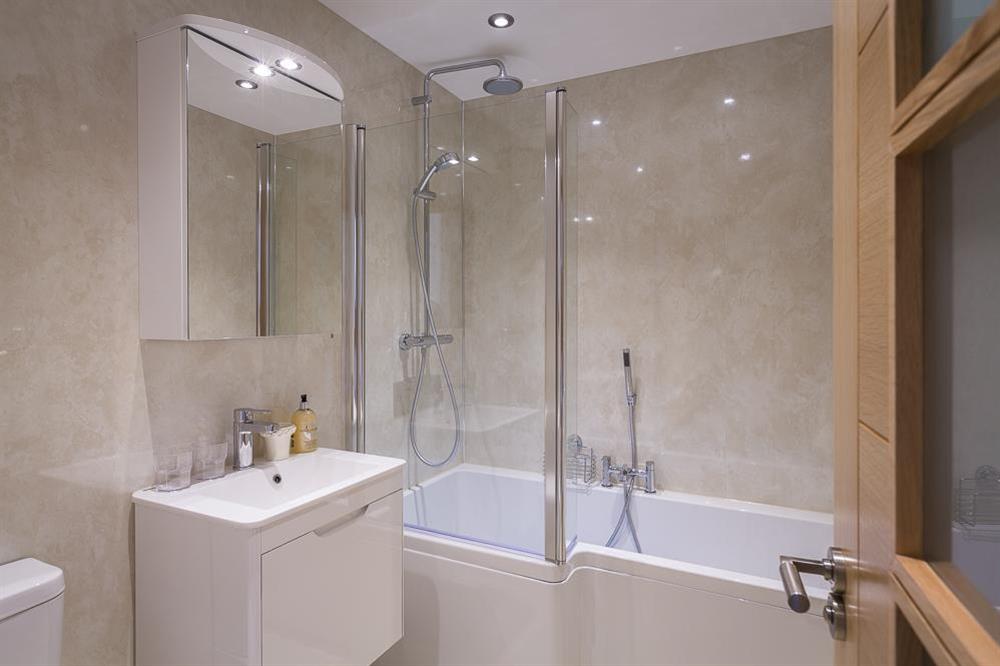 En suite features a bath with a rainhead shower (photo 2) at Butterwell Barn in , Nr Dartmouth