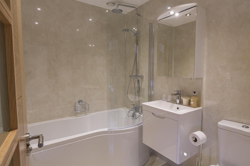 En suite features a bath with a rainhead shower at Butterwell Barn in , Nr Dartmouth