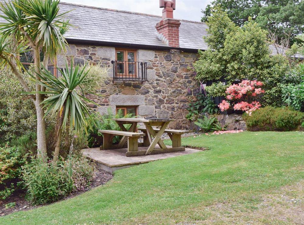 Sitting-out-area in garden at Buzzard Barn in St Martin, Nr Helston, Cornwall., Great Britain