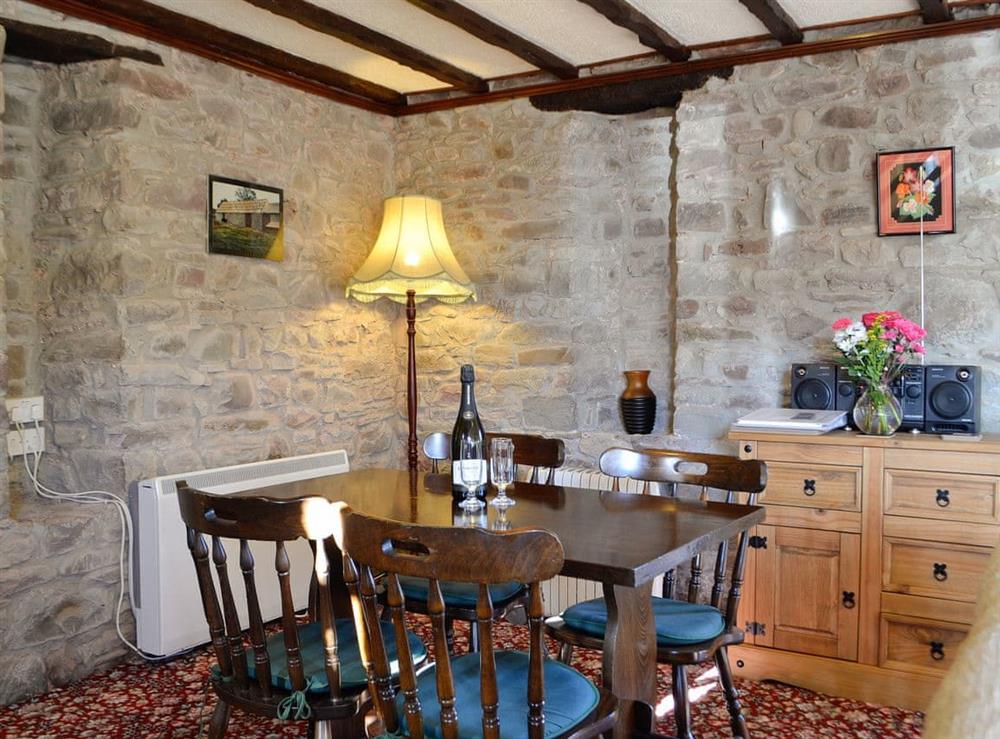 Living room with dining area (photo 2) at Buzzard Cottage in Defynnog, near Brecon, Powys