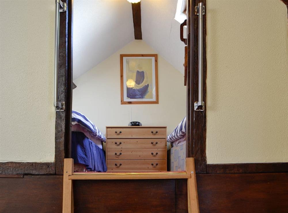 Steps to twin bedroom at Buzzard Cottage in Defynnog, near Brecon, Powys