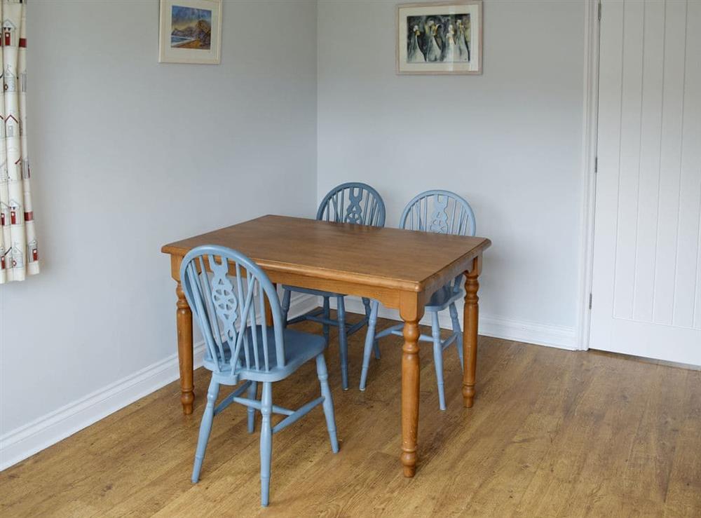 Convenient dining area within living room at Buzzards in Bothenhampton, near Bridport, Dorset