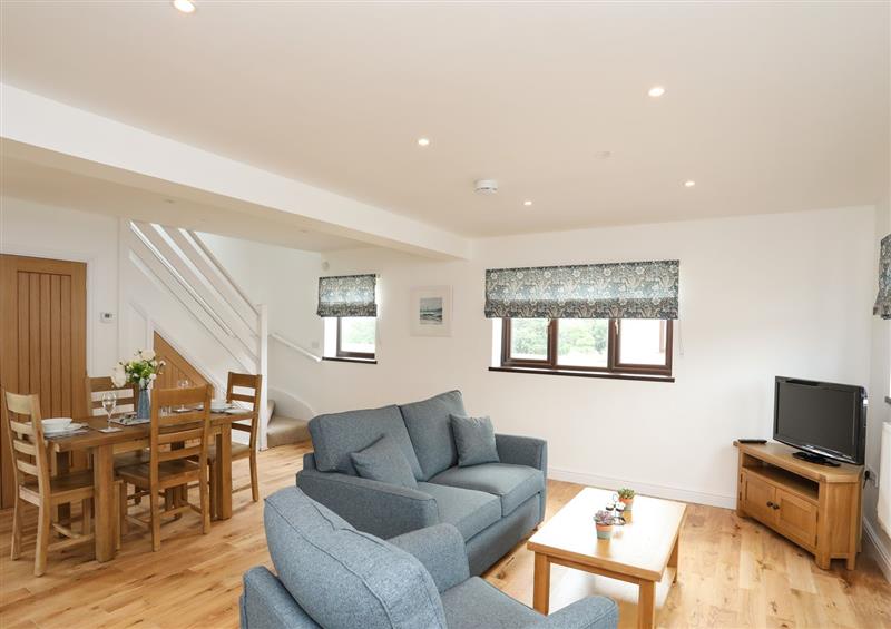 Relax in the living area at Bwthyn Cae Haidd, Beaumaris