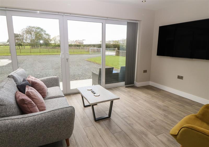 Relax in the living area at Bwthyn Caer Efail, Rhosgoch near Cemaes Bay
