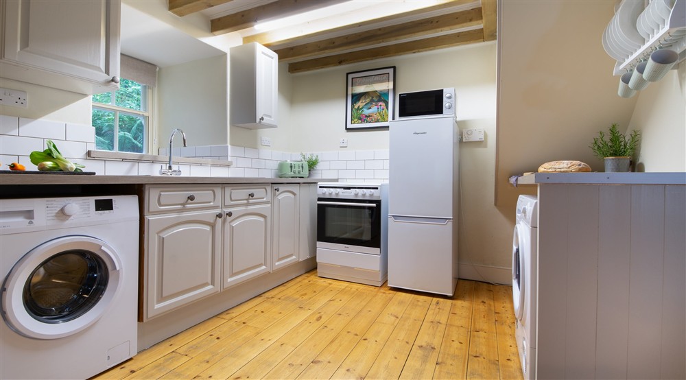 The open plan kitchen, sitting and dining room (photo 2) at Bwthyn Mai in Beddgelert, Gwynedd