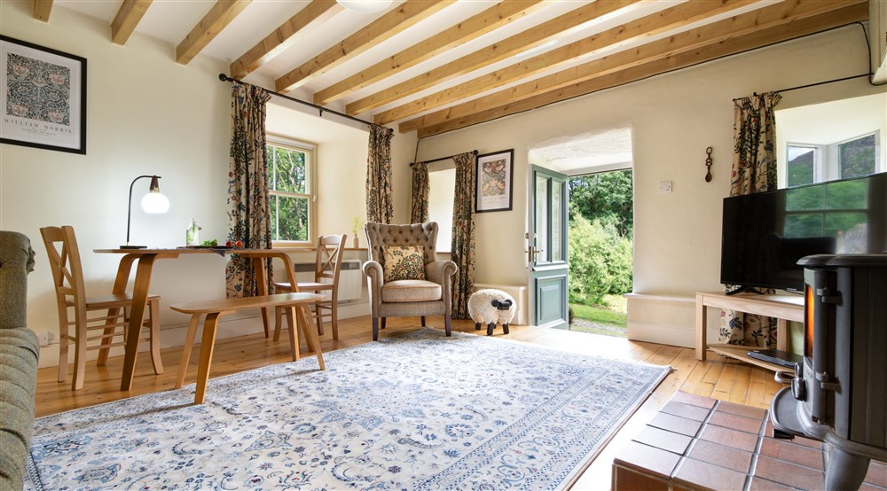The open plan kitchen, sitting and dining room (photo 3) at Bwthyn Mai in Beddgelert, Gwynedd